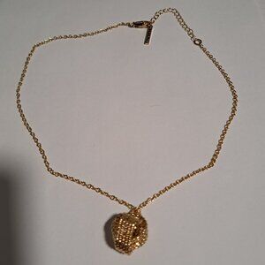 Tahari gold tone necklace with knot pendant